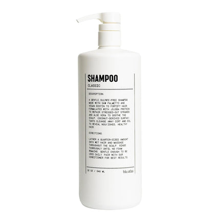 A tall white plastic pump bottle of Bbb Bio-Based shampoo with black text on the front label, shown against a plain white background.