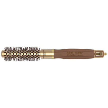 Close-up of the bristles on a Olivia Garden NanoThermic Round Thermal hair brush, showing a mix of black and brown bristles designed for hair styling.